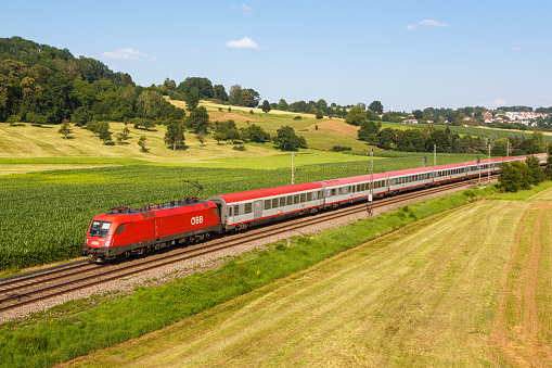 Uhingen, Germany - July 21, 2021: InterCity IC train of ÖBB Österreichische Bundesbahnen in Uhingen, Germany.