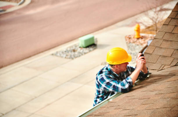 insurance agent or roofer on roof assessing damage to a roof - yttertak bildbanksfoton och bilder