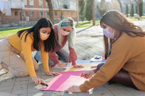 Multicultural group preparing together feminist movement womens international day 8m stock photo