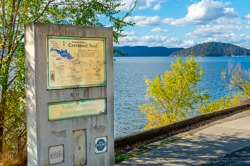 A sign for the Centennial Trail along Lake Coeur d'Alene near Higgins Point in Coeur d'Alene, Idaho, USA.