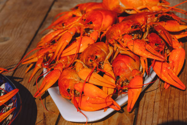 istock Red cooked crawfish and glasses of beer. 1369024401