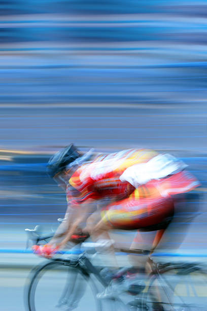 XXL fast bicycle racer fast bicycle racer with motion blur, vertical frame (XXL) cycle racing stock pictures, royalty-free photos & images