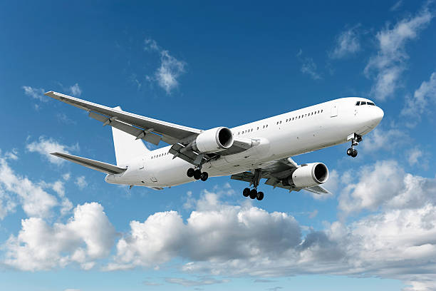 istock XXL jet airplane landing in bright sky 136902667