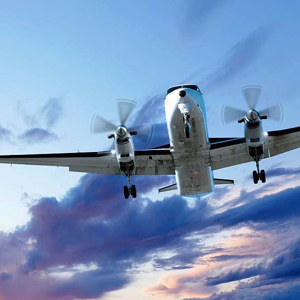 istock propeller airplane landing at dusk 136902676