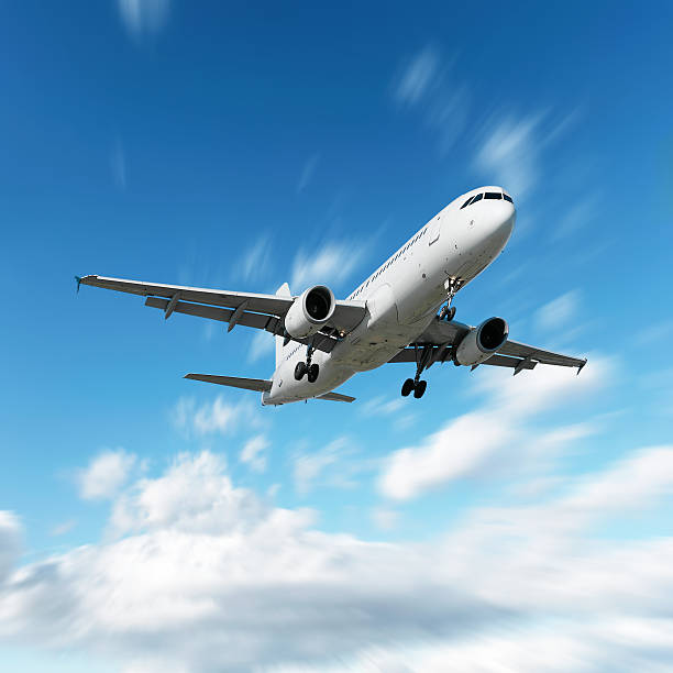 istock XL jet airplane landing in motion blur sky 136902682