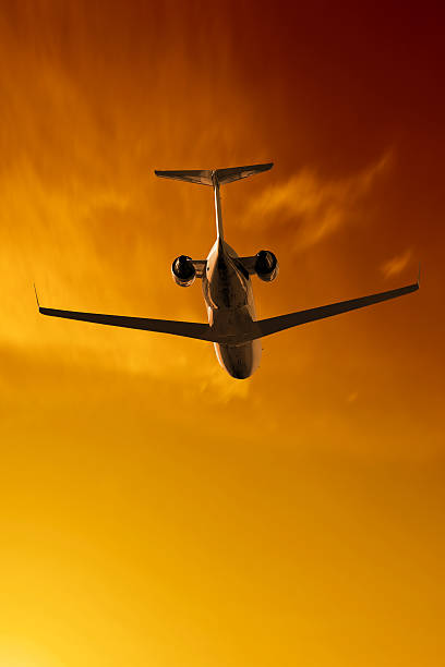 istock XXL corporate jet airplane flying at sunset 136902699