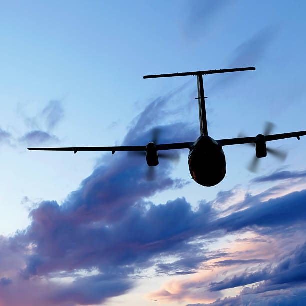 istock propeller airplane flying at dusk 136902732