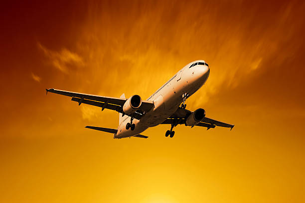 istock XL jet airplane landing at sunset 136902797