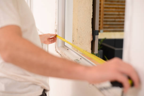istock handsome young professional man installing and replacing a new home windows in client house for improvement energy saving efficiency isolation 1369028364