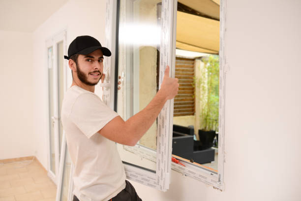 istock handsome young professional man installing and replacing a new home windows in client house for improvement energy saving efficiency isolation 1369028373