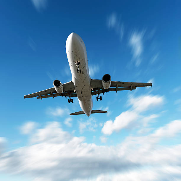 istock XL jet airplane landing in motion blur sky 136902904