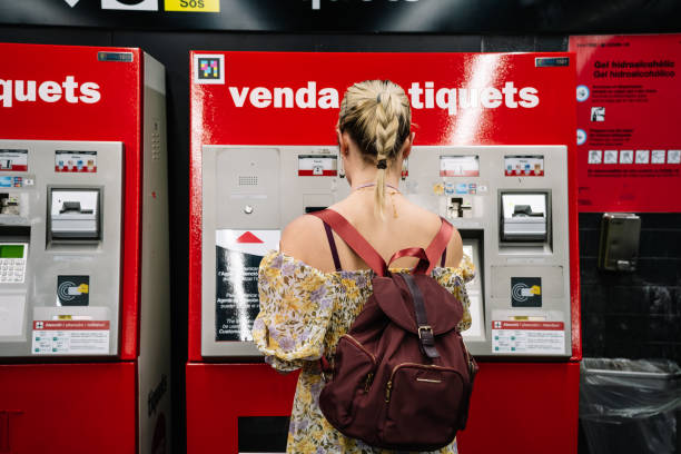 istock Woman with beverage buying ticket in terminal 1369030259