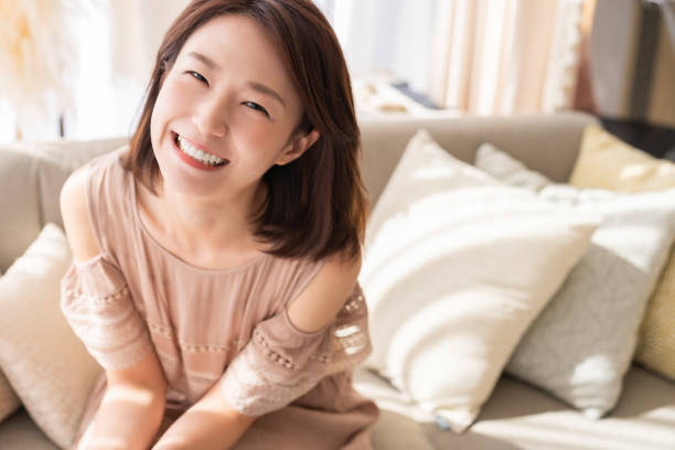istock attractive asian woman relaxing 1369031155
