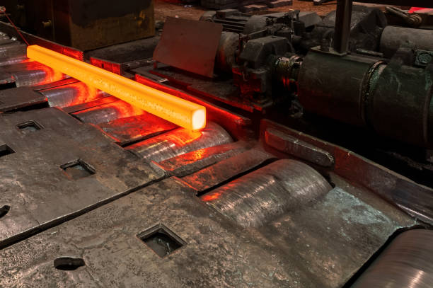 istock Red-hot metal billet on the roller table of a rolling mill 1369032021