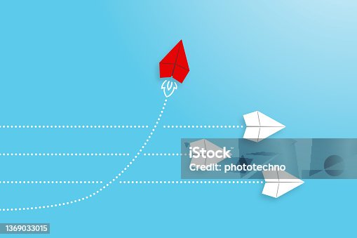 istock Change concepts with red paper airplane leading among white 1369033015