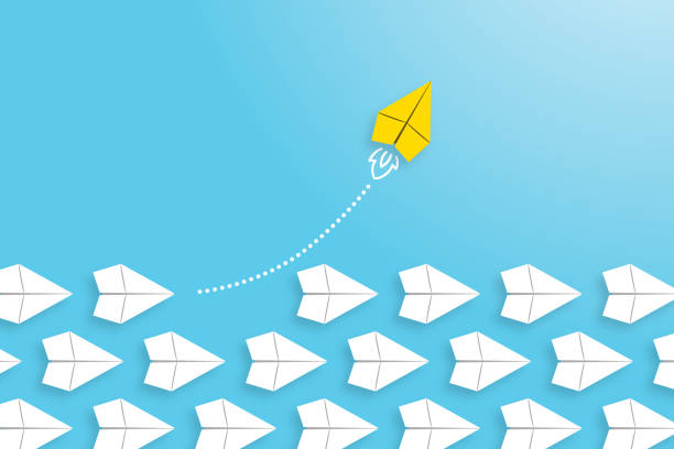 istock Change concepts with yellow paper airplane leading among white 1369033047