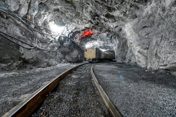 istock Underground mine. Underground railway for transporting ore. Mine trolley as part of an underground freight train 1369033727