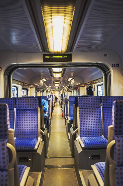 istock passenger train inside with blue seats in Germany 1369038382