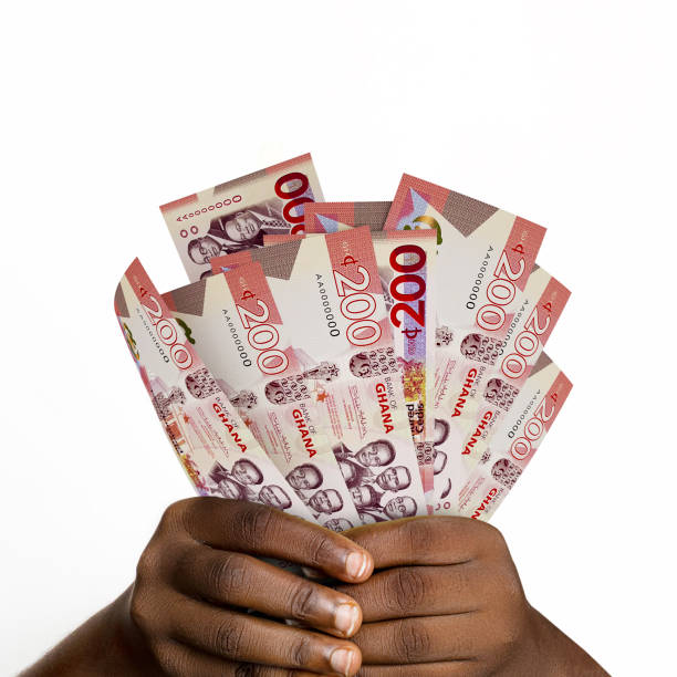 Black hands holding 3D rendered 200 Ghanaian cedi notes. closeup of Hands holding Ghanaian currency notes Black hands holding 3D rendered 200 Ghanaian cedi notes. closeup of Hands holding Ghanaian currency notes ghana stock pictures, royalty-free photos & images