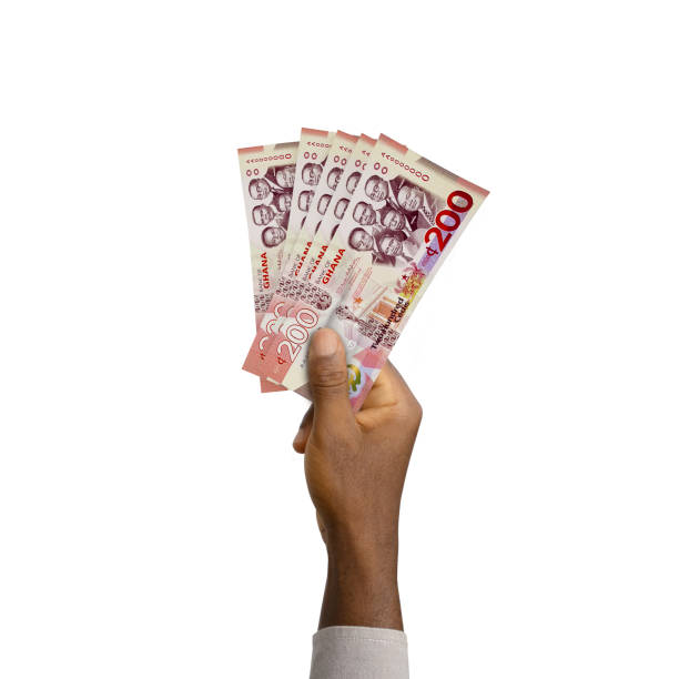 istock Black Hand holding 3D rendered Ghanaian cedi notes 1369041815