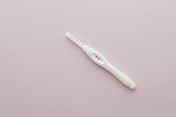 istock top view of Pregnancy test kit on light purple background 1369042350