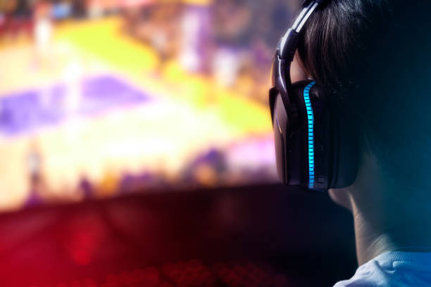 istock Rearview shot of a young man playing computer games 1369043687
