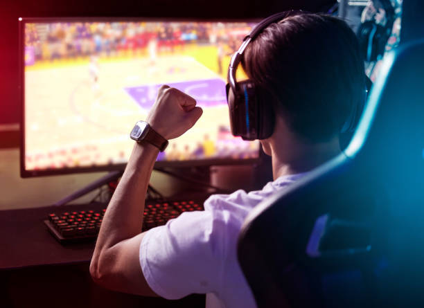 istock Shot of a young man cheering while playing computer games 1369044427