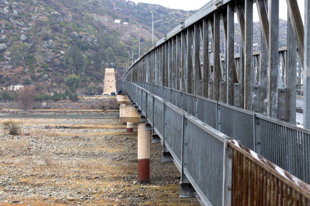 istock Steel bridge on a river swat valley 1369044531