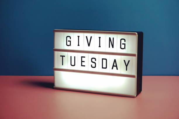 istock Giving Tuesday word in light box on blue and pink background 1369046353