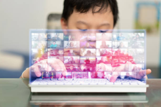 istock boy use keyboard to video call for e learning via hologram metaverse 1369047318
