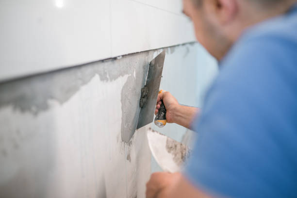 istock Close-up of gluing ceramic tiles 1369051095