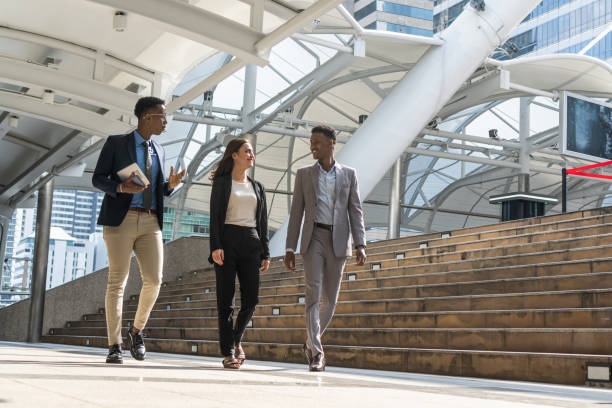 istock Business people walking trough passage 1369052105