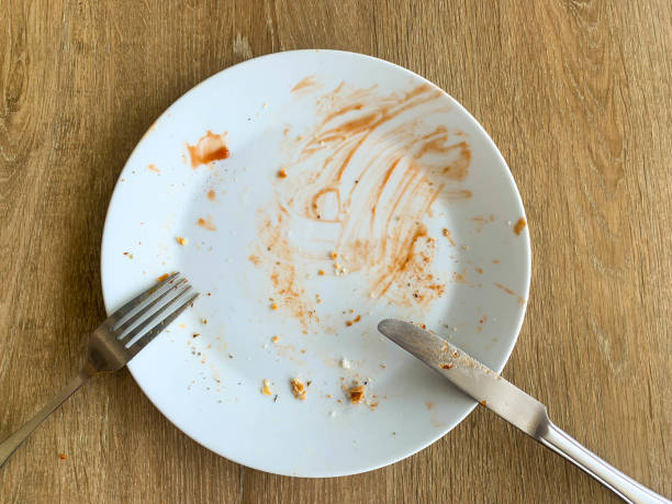istock Dirty dish on wood table 1369052993