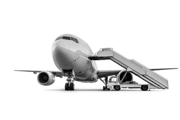 istock Wide body passenger jet plane with staircase isolated on white background 1369054962