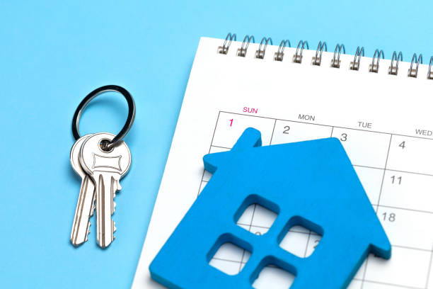 istock House keys and calendar on a blue background 1369055060