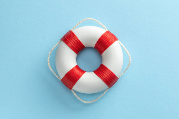istock Lifebuoy on a blue background in the center 1369055079