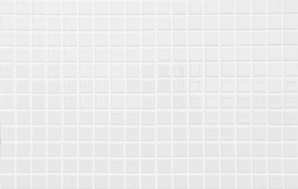 istock White or gray ceramic wall and floor tiles abstract background. Design geometric mosaic texture decoration of the bedroom. Simple seamless pattern for backdrop hospital wall, canteen and grid paper. 1369057206