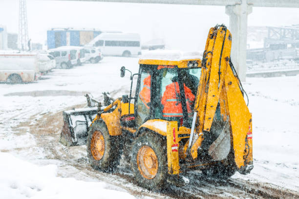 istock View of a backhoe loader and snowy day in the construction site. It also called a loader backhoe, digger in layman's terms, or colloquially shortened to backhoe within the industry. 1369059413