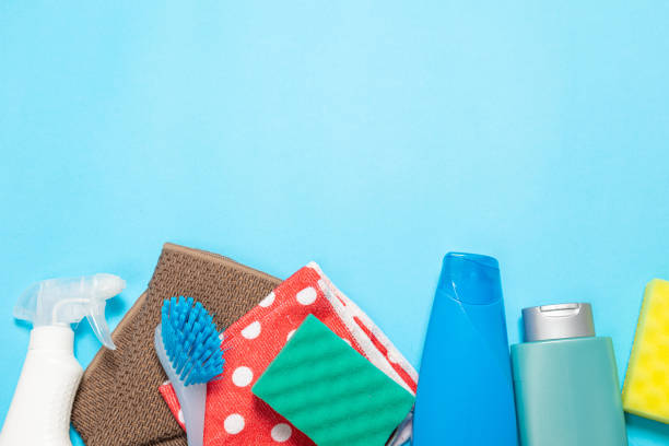 istock bottles and sprays cleaning agent brushes sponges rags on a colored background on the side. Professional cleaning products, general cleaning. Household chemicals 1369064290