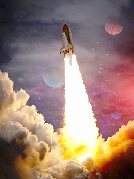 istock shuttle launch in the clouds to outer space. Dark space with stars on background.Spaceship flight. Elements of this image furnished by NASA 1369066281