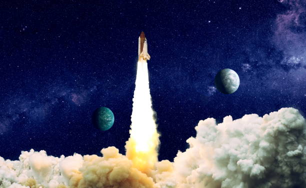 istock shuttle launch in the clouds to outer space. Dark space with stars on background.Spaceship flight. Elements of this image furnished by NASA 1369066295