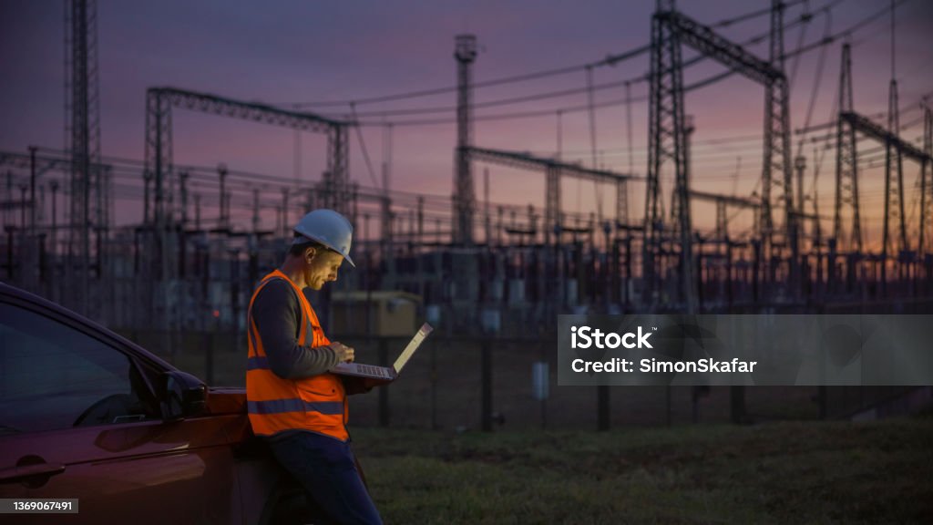 Quality control on Power station at dusk Electricity Stock Photo