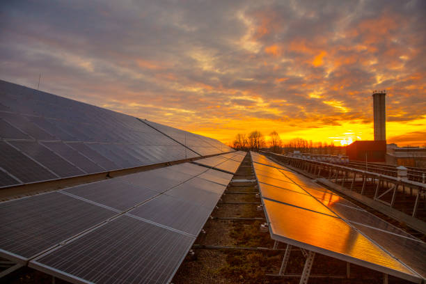 istock Photovoltaic solar power panel industrial cell on dramatic sunset sky background. Alternative power energy concept. 1369067684