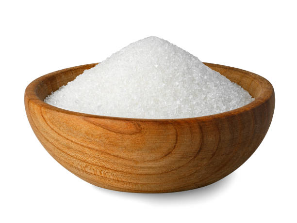 istock sugar in wooden bowl isolated on white 1369070514