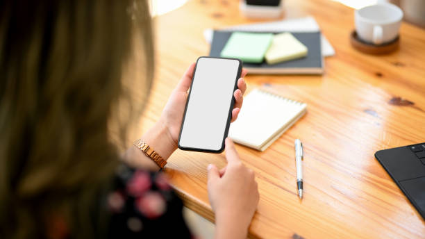 istock Close-up image, A female using smartphone. phone blank screen. 1369070796