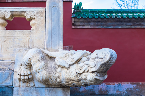 Beijing, China - April 13, 2012: Centre Stairway with Marble Carving of Nine Dragons playing with pearls. Forbidden City.