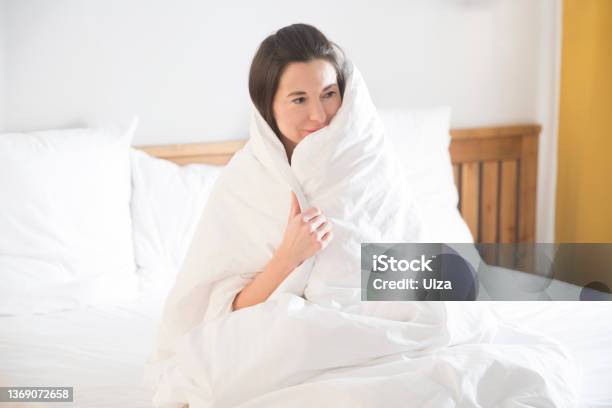Woman Lying In Bed Under A Blanket Insomnia Healthy Sleep Stock Photo - Download Image Now