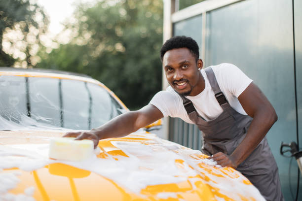 istock African man washing his car 1369073848