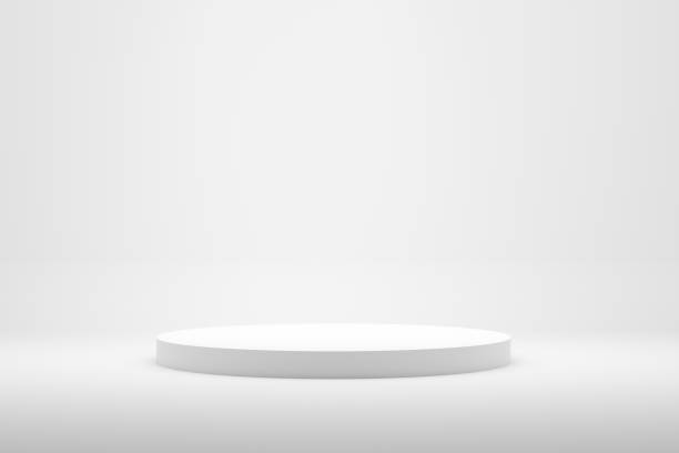 istock Blank white podium platform or pedestal with white background for product display. 1369074034