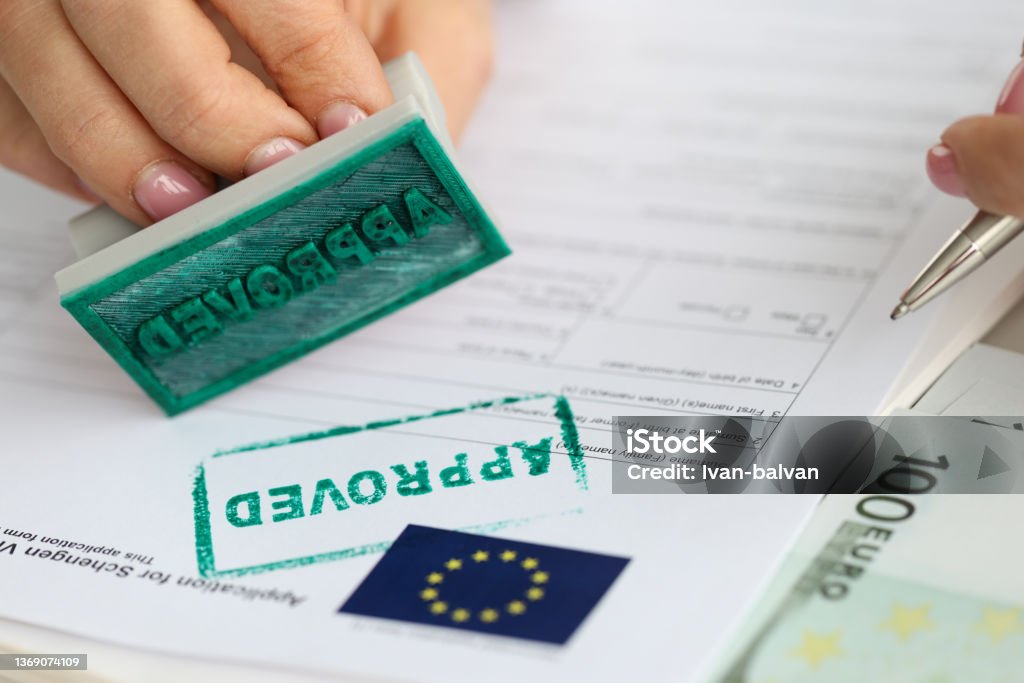 EU visa application approved. Document applying for entry into European Union EU visa application approved. Getting Schengen visa concept Schengen Agreement Stock Photo